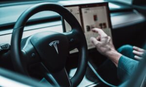 Person using touch screen in Tesla.